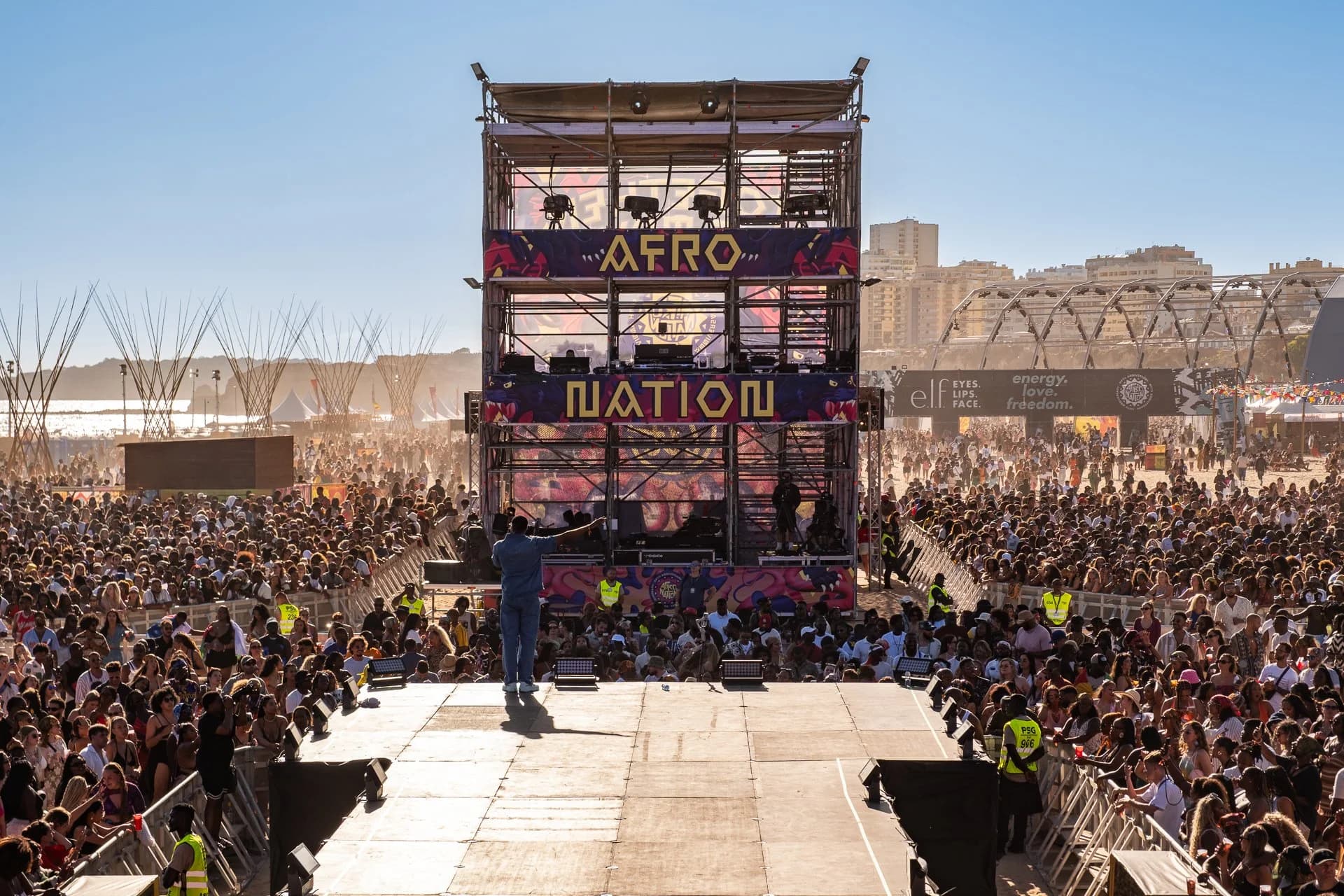 The Afro Nation tower and the crowd it plays to